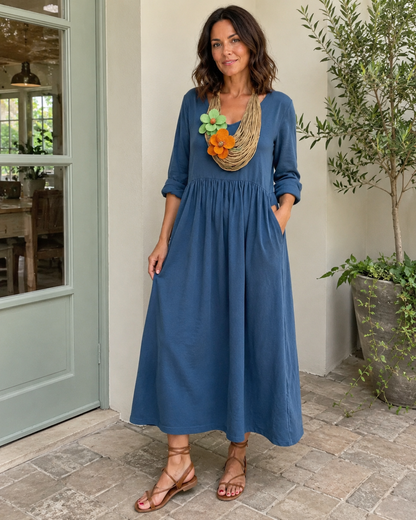 Vestido longo de linho com gola redonda e bolsos